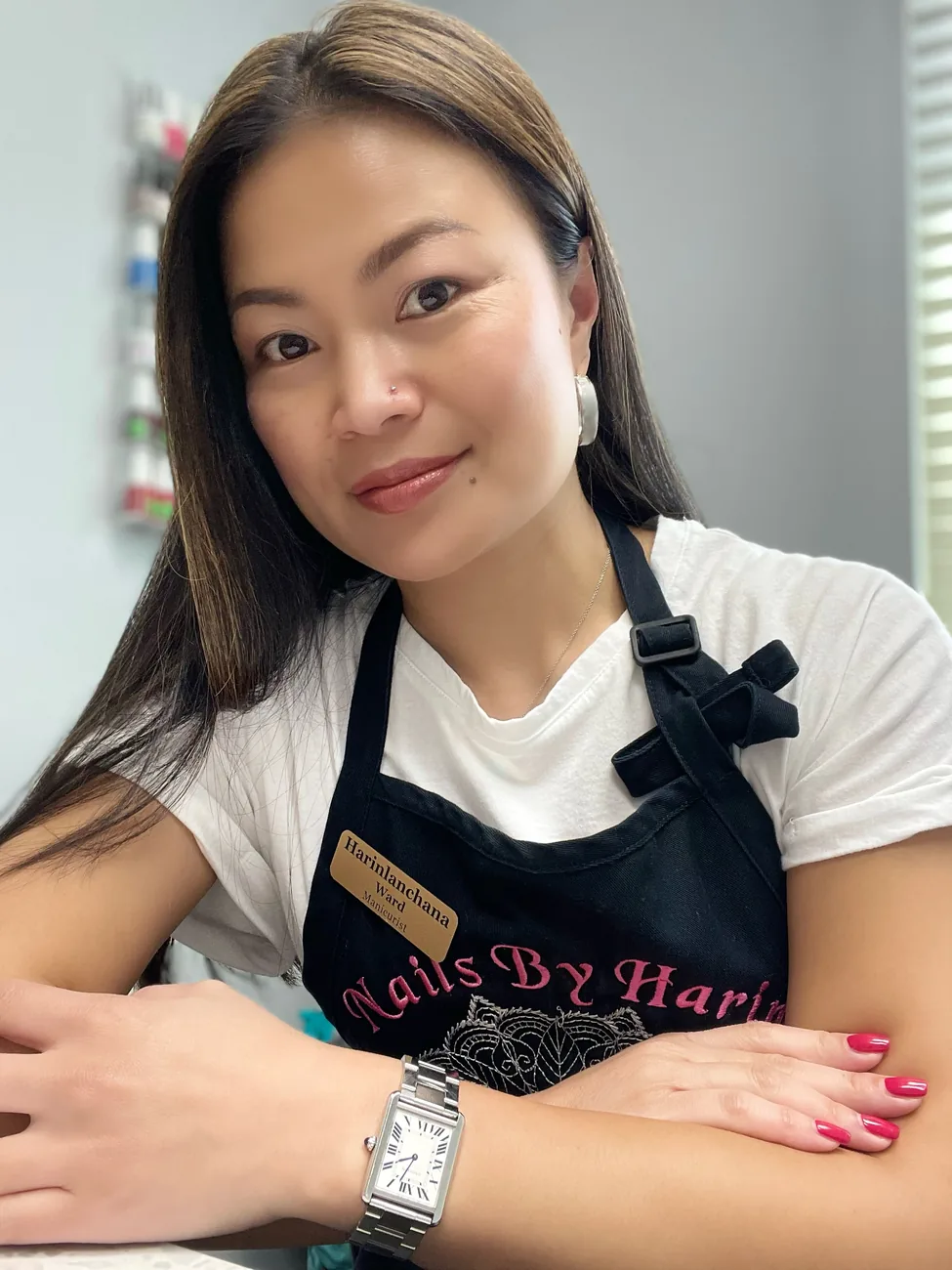 Harin, owner and nail artist, in her Nails By Harin apron at Ultimate Beauty Salon in Durham