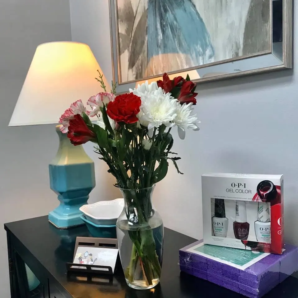 Fresh flowers and OPI gel colour at the Ultimate Beauty Salon nail station